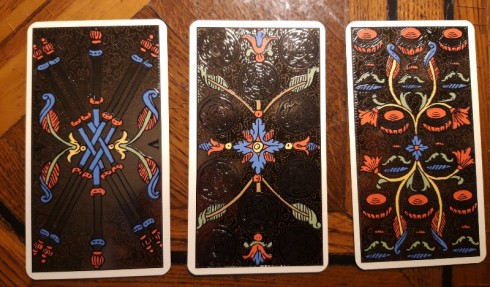 5 of Wands / 10 of Coins / 8 of Cups